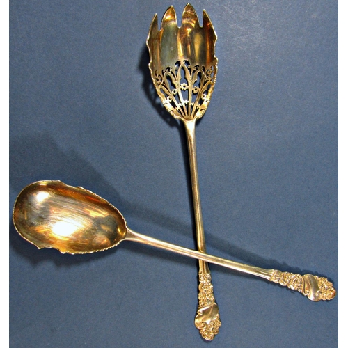 1268 - A pair of silver salad serving spoons with floral and filigree decoration, 24 cm long approx, London... 