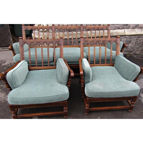 2182 - An Ercol Colonial three piece suite comprising three seat sofa and a pair of matching armchairs with... 