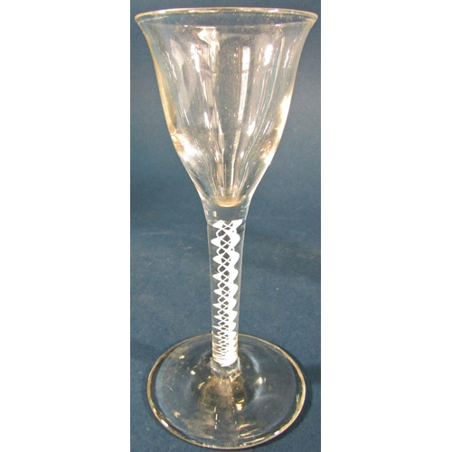 1152 - A Georgian funnel bowl wine glass with a double series air twist stem 15cm high, and a Georgian spir... 