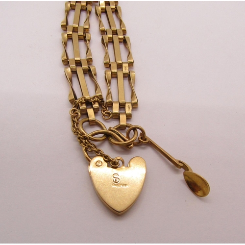 1299 - 9ct twisted gate link bracelet with engraved heart padlock clasp and Welsh love spoon charm, 12.6g