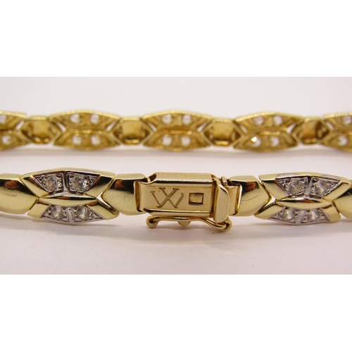 1330 - 14ct fancy link bracelet set with white stones, 11.5g