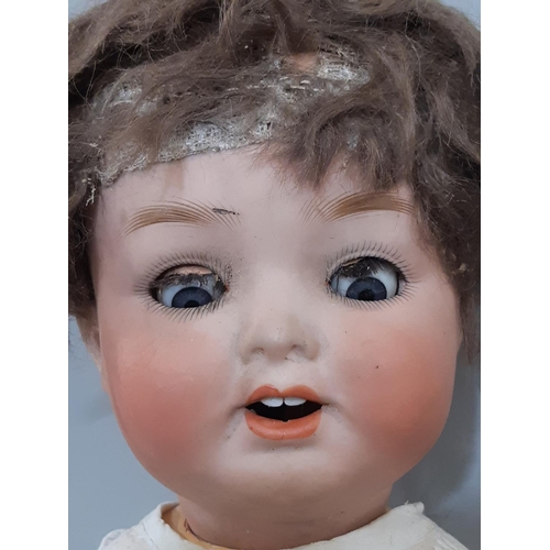 371 - Early 20th century German bisque head character doll by Ernst Heubach for restoration, with bent lim... 