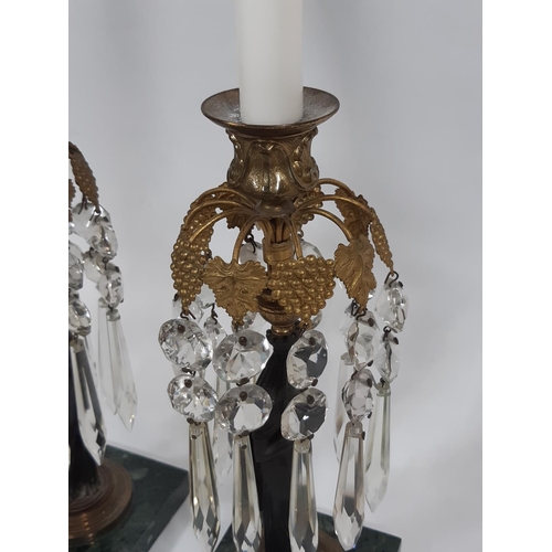 1153a - A pair of Regency table candlesticks decorated with ten gilt vine and grape fronds hung with glass l... 