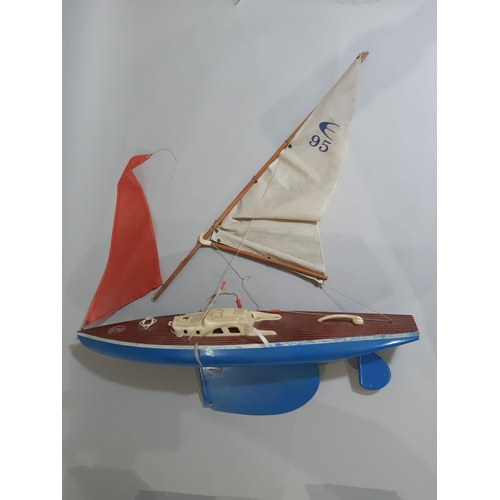 332 - Vintage toys including 'Giner' pond yacht, large multi levelled toy garage, (both for restoration), ... 