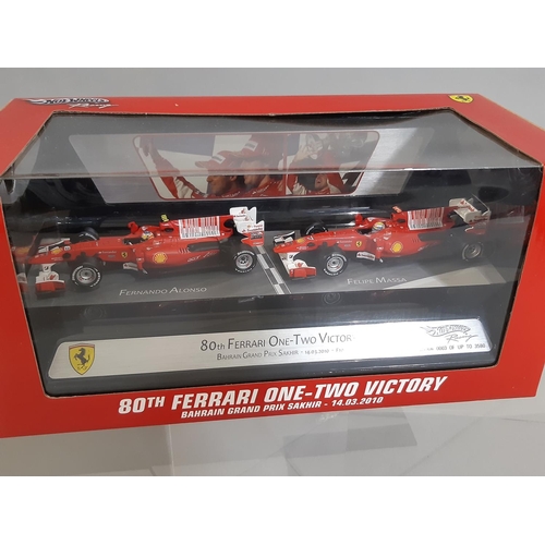 344 - 5 boxed models of Formula 1 racing cars by Hot Wheels including 1:18 scale F10 Bahrain GP Edition (M... 