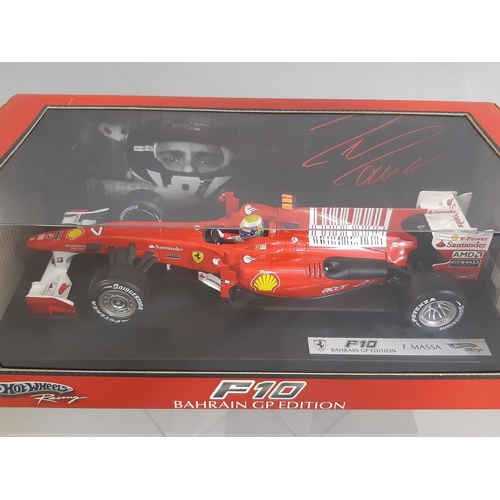 344 - 5 boxed models of Formula 1 racing cars by Hot Wheels including 1:18 scale F10 Bahrain GP Edition (M... 