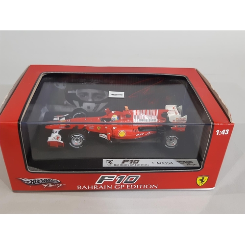 344 - 5 boxed models of Formula 1 racing cars by Hot Wheels including 1:18 scale F10 Bahrain GP Edition (M... 