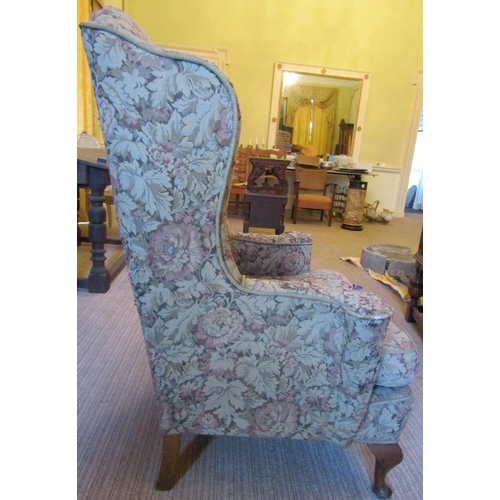 2568 - To be viewed at and collected from Nibley House GL11 6DL: A Georgian style wing chair with swept arm... 