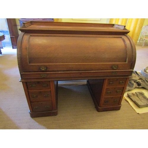 2577 - To be viewed at and collected from Nibley House GL11 6DL: A Victorian oak cylinder top desk, enclosi... 