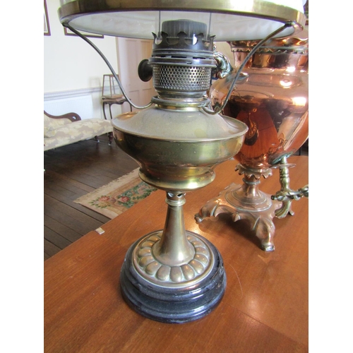 2587 - To be viewed at and collected from Nibley House GL11 6DL: A brass oil lamp with milk white shade tog... 