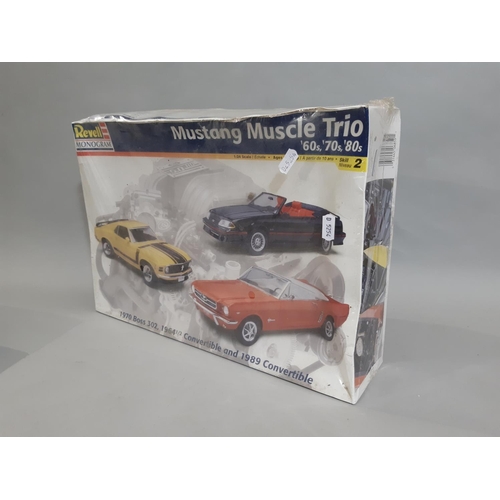 384 - 3 boxed models; Mustang Muscle Trio by Revell 1:24 scale, a 'Bluebird 1933' model racing car 1:43 sc... 