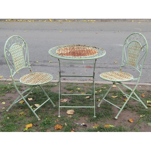 2047 - A three piece light green painted folding steel garden terrace set with decorative pierced detail, t... 