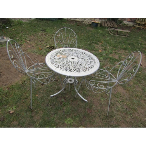 2050 - A cast aluminium garden terrace table with pierced scrolling foliate panelled top and swept supports... 