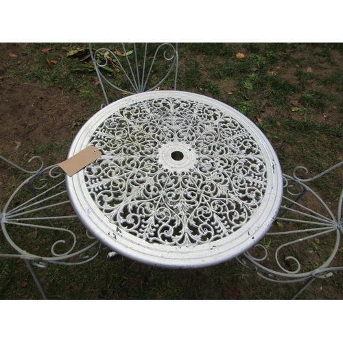 2050 - A cast aluminium garden terrace table with pierced scrolling foliate panelled top and swept supports... 