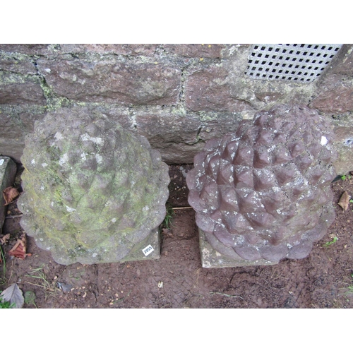 2055 - A pair of weathered cast composition stone pineapple pier cap finials 60 cm high approx, together wi... 