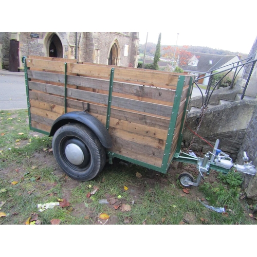 2058 - A livestock/sheep trailer with iron and timber slatted frame, the main body approx 2 metres long x 1... 