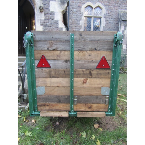 2058 - A livestock/sheep trailer with iron and timber slatted frame, the main body approx 2 metres long x 1... 