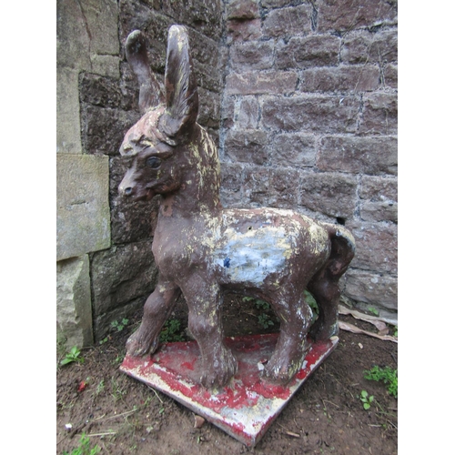 2059 - A cast composition stone garden ornament in the form of a standing donkey with painted finish and se... 