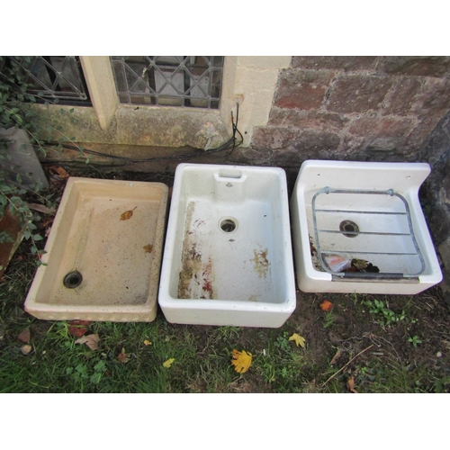 2060 - Three reclaimed glazed stoneware sinks of varying size and design to include a Royal Doulton example... 