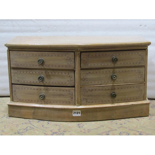 2121 - An Edwardian bleached mahogany bow fronted table chest of six drawers with inlaid chevron banding 57... 