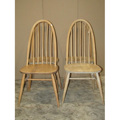 2183 - A set of four stripped Ercol Quaker elm and beechwood high hoop and stick back dining chairs