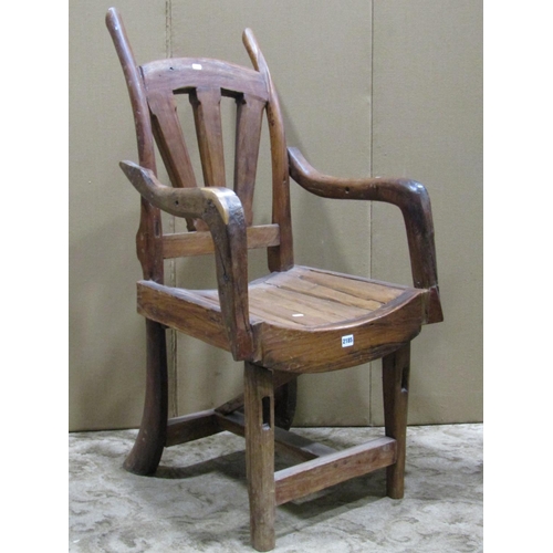 2185 - A vintage rustic wooden open armchair with dished seat