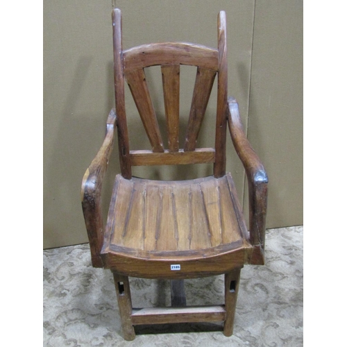 2185 - A vintage rustic wooden open armchair with dished seat