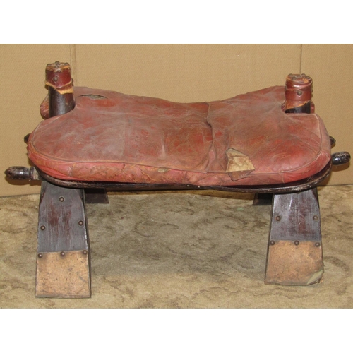 2188 - A vintage camel stool with leather pad seat (af)