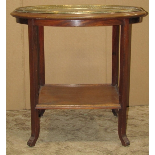 2191 - An Eastern oval engraved brass tray top occasional table raised on a mahogany stand with square cut ... 