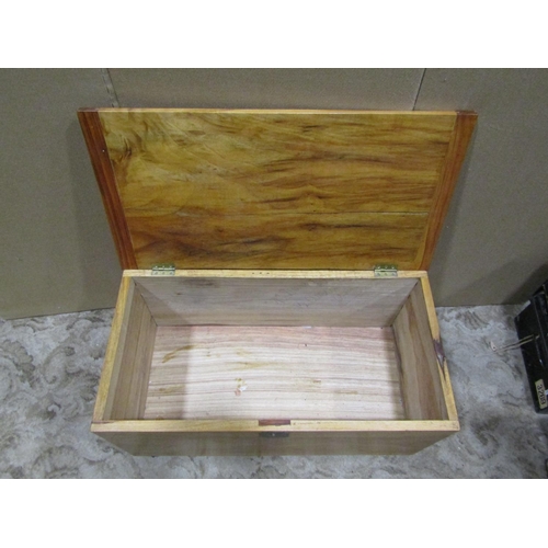 2199 - A camphor wood chest with hinged lid and brass fittings, 74 cm wide x 38 cm deep x 39 cm high