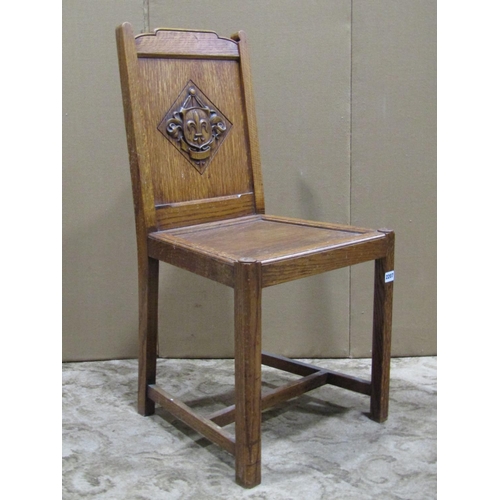 2207 - An oak hall chair with solid seat and panelled back, label to seat rail Waring & Gillow Ltd and impr... 