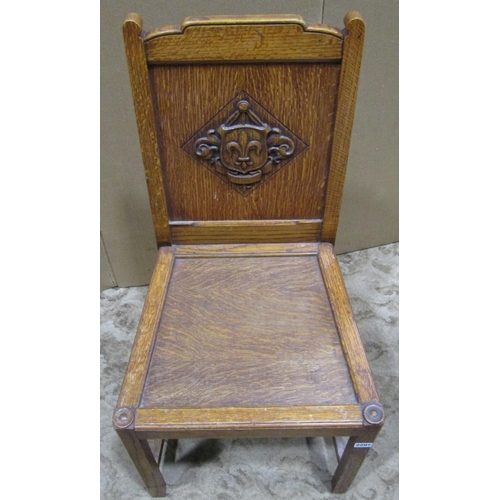 2207 - An oak hall chair with solid seat and panelled back, label to seat rail Waring & Gillow Ltd and impr... 