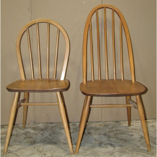 2208 - Three light Ercol elm and beechwood stick back dining chairs of varying design, together with other ... 