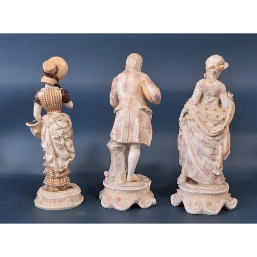 1003A - A pair of 19th century German porcelain figures in pink floral costumes and one other figure, 27cm h... 