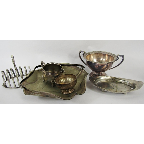 1177 - A selection of silver plated items including a meat cover, a circular tray, tea and coffee pots, toa... 