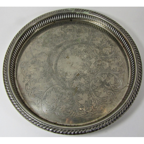 1185 - A circular silver plated pierced galleried tray 27cm diam, an oval silver plated tureen lid, a cloth... 