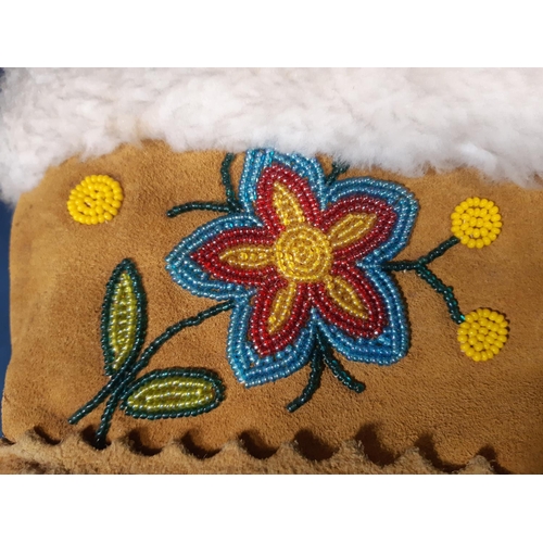 1588 - A pair of sheepskin mittens with long cuff and floral beading detail, North American Native style, l... 