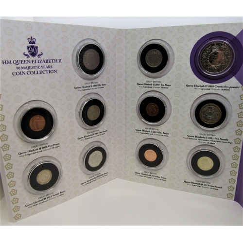 521 - Boxed set 9 volumes H M Queen Elizabeth II 90 Majestic years coin collection