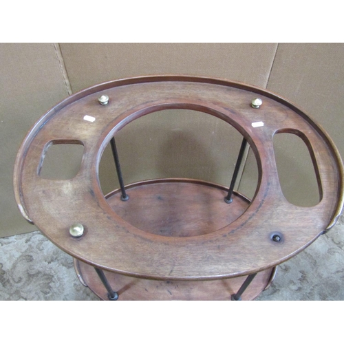 2286 - A 19th century campaign washstand on three oval mahogany tiers raised on tubular rod supports with b... 