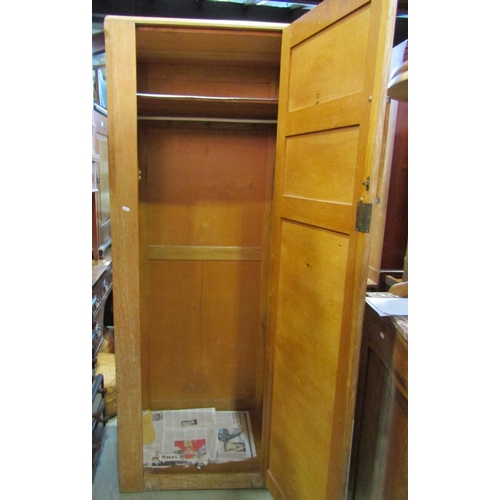 2289 - A small limed oak linen cupboard enclosed by two doors over two long drawers, 75 cm wide together wi... 