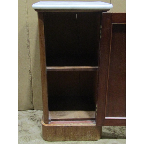 2315 - A Victorian mahogany bedside cupboard with loose white marble top over a rectangular panelled door s... 