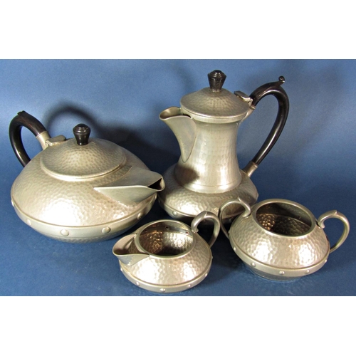 1192 - A four piece Craftsman Arts and Crafts style pewter hammered tea service with a similar Knighthood c... 