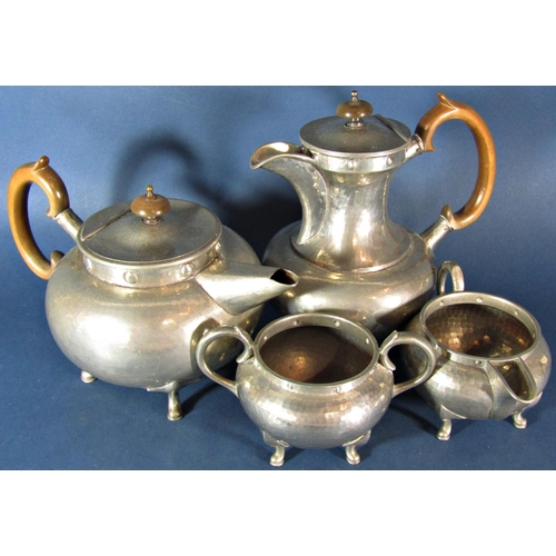 1197 - An Arts and Crafts style pewter four piece tea service and oval trays, made by Don Pewter.