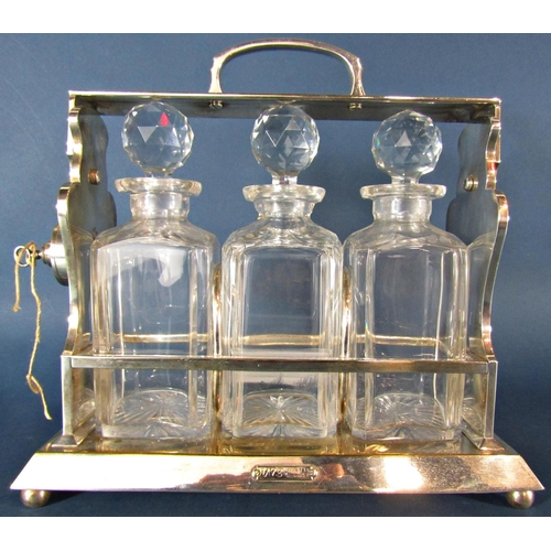 1198 - A Betjemanns Patent silver plated three bottle tantalus 30cm w x 30cm h. (Lock as found)