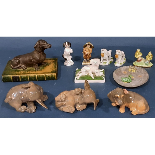 1087 - A collection of animal related figures including three Copenhagen puppies, 19th century Staffordshir... 