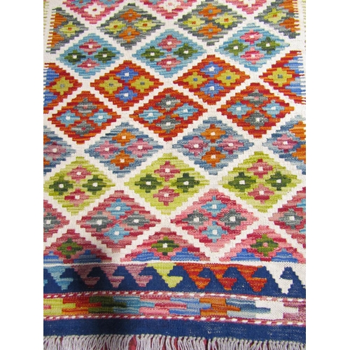 2515 - A Chobi kilim runner with a multi colour small diamond pattern, 197cm x 66cm approx.