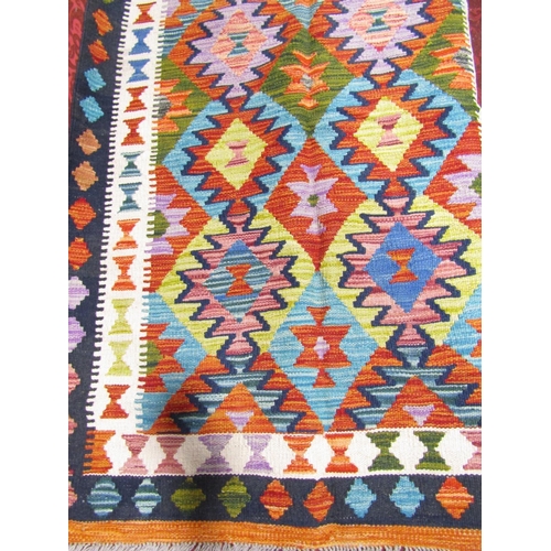 2524 - A Chobi kilim with a multi coloured geometric pattern, 152cm x 100cm approx.