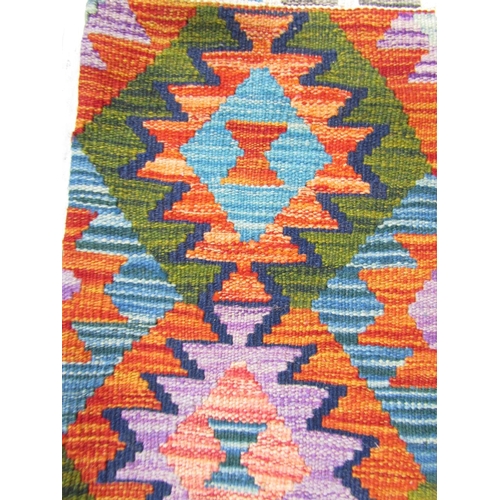 2524 - A Chobi kilim with a multi coloured geometric pattern, 152cm x 100cm approx.