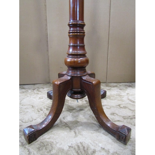 2350 - A turned mahogany standard lamp raised on swept quadruped supports, 161 cm (full height)