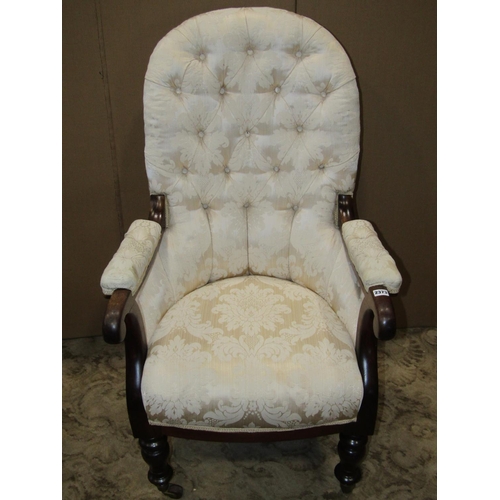 2373 - A Victorian button back drawing room chair with open scrolled arms, set on turned supports and casto... 